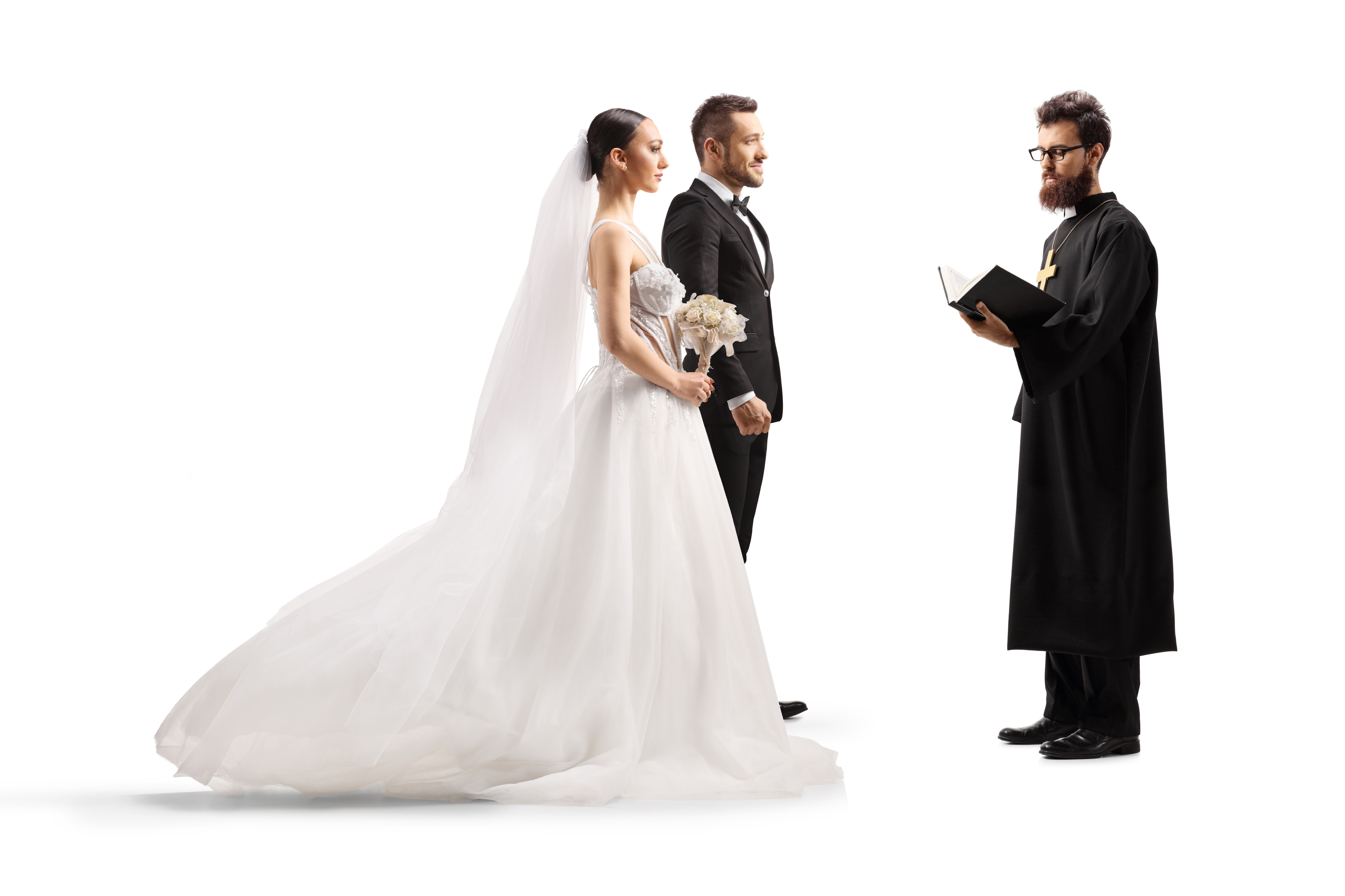 Bride and groom standing in front of a priest at a wedding ceremony isolated on white background
